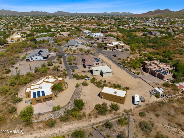 birds eye view of property with a mountain view