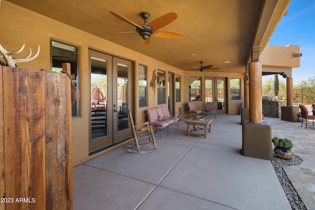 view of patio / terrace featuring ceiling fan and french doors