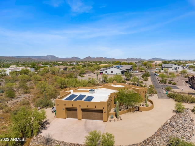 drone / aerial view featuring a mountain view