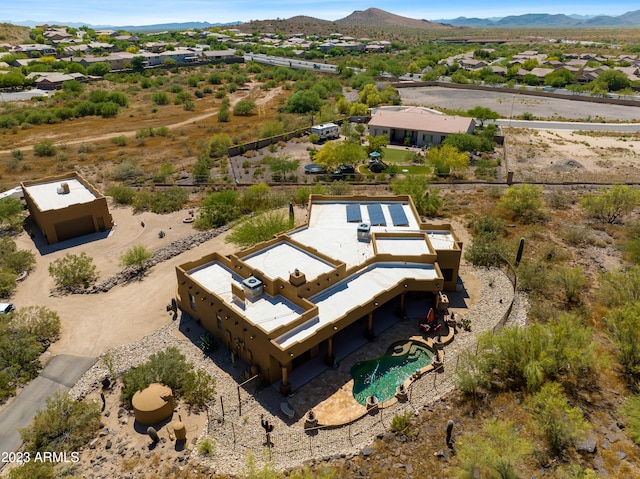 birds eye view of property with a mountain view