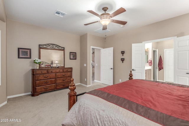 bedroom with visible vents, a ceiling fan, ensuite bath, carpet flooring, and baseboards