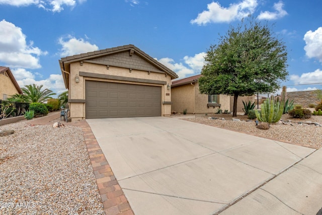 ranch-style house with a garage, driveway, and stucco siding