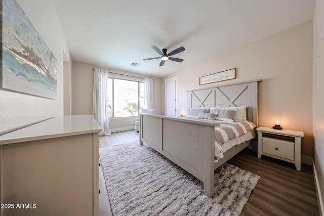 bedroom featuring ceiling fan and dark hardwood / wood-style floors