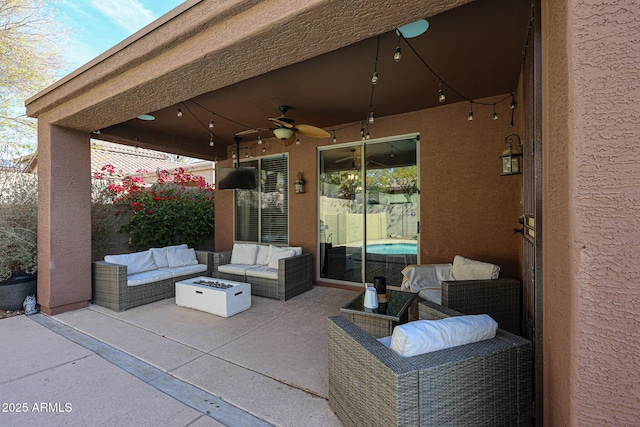 view of patio / terrace with an outdoor living space with a fire pit and ceiling fan