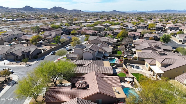 birds eye view of property featuring a mountain view