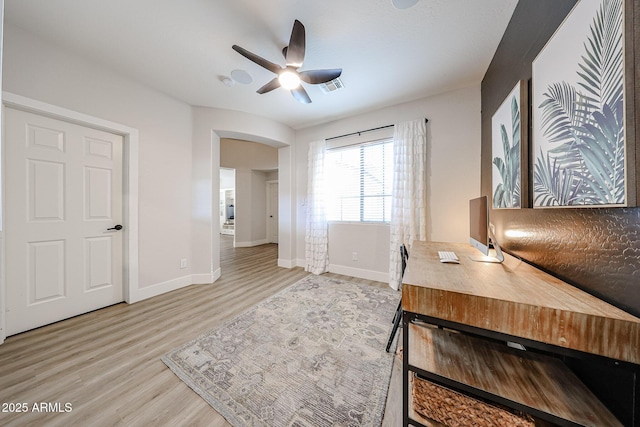 office space featuring ceiling fan and light hardwood / wood-style flooring