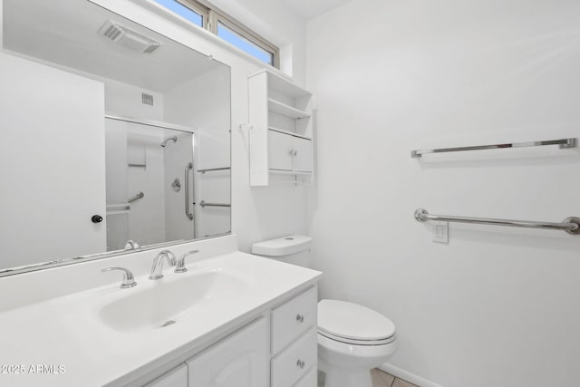 11044 W Cheryl Dr, Sun City, AZ 85351 - full bathroom with toilet, an enclosed shower, vanity, and tile patterned floors