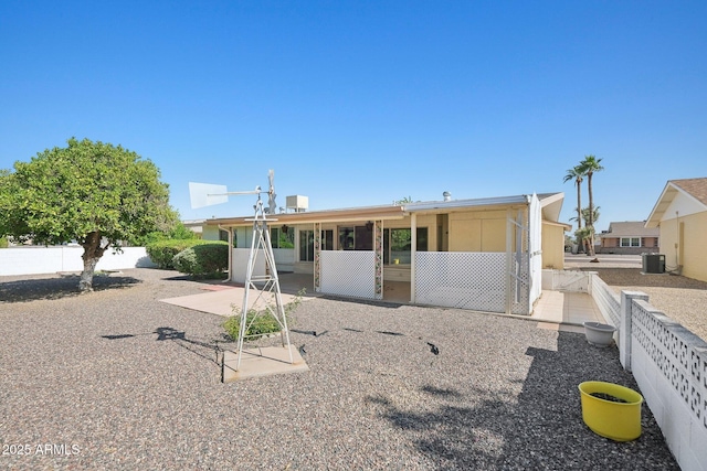 11044 W Cheryl Dr, Sun City, AZ 85351 - view of front of property featuring a patio, cooling unit, and a fenced backyard