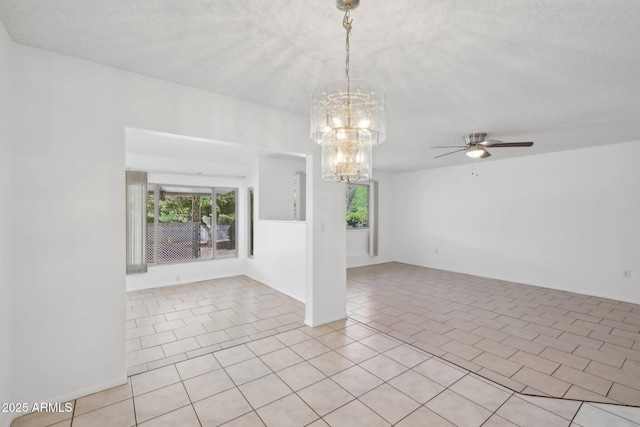 11044 W Cheryl Dr, Sun City, AZ 85351 - empty room with a chandelier, a ceiling fan, plenty of natural light, and light tile patterned flooring