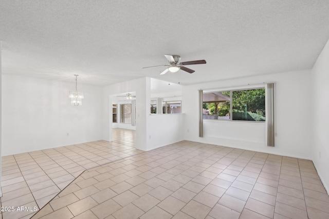 11044 W Cheryl Dr, Sun City, AZ 85351 - unfurnished living room with a ceiling fan, a textured ceiling, and a chandelier