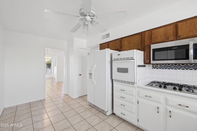 11044 W Cheryl Dr, Sun City, AZ 85351 - kitchen with appliances with stainless steel finishes, light countertops, backsplash, light tile patterned floors, and ceiling fan