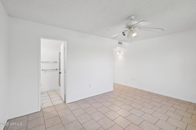 11044 W Cheryl Dr, Sun City, AZ 85351 - spare room with ceiling fan, a textured ceiling, and light tile patterned floors