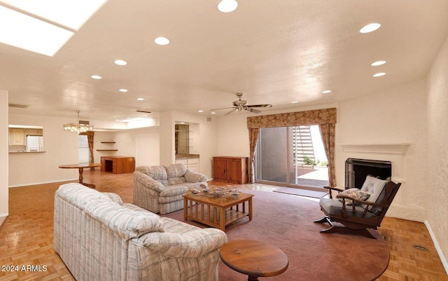 living room with ceiling fan and light parquet flooring