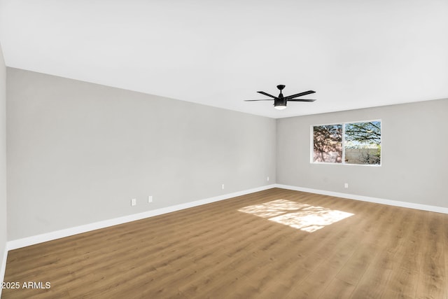 25810 S Boxwood Dr, Sun Lakes, AZ 85248 - spare room featuring baseboards, wood finished floors, and ceiling fan
