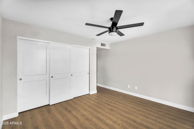 25810 S Boxwood Dr, Sun Lakes, AZ 85248 - unfurnished bedroom featuring baseboards, a closet, wood finished floors, and ceiling fan