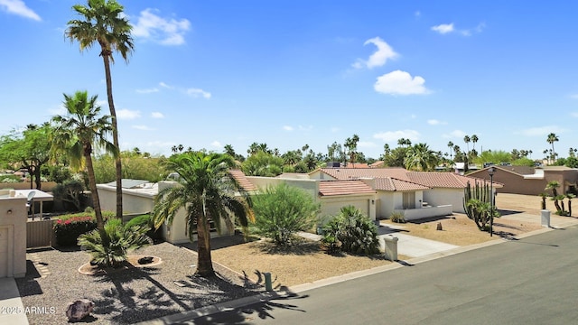 25810 S Boxwood Dr, Sun Lakes, AZ 85248 - view of front of house featuring stucco siding, concrete driveway, a tiled roof, and a garage