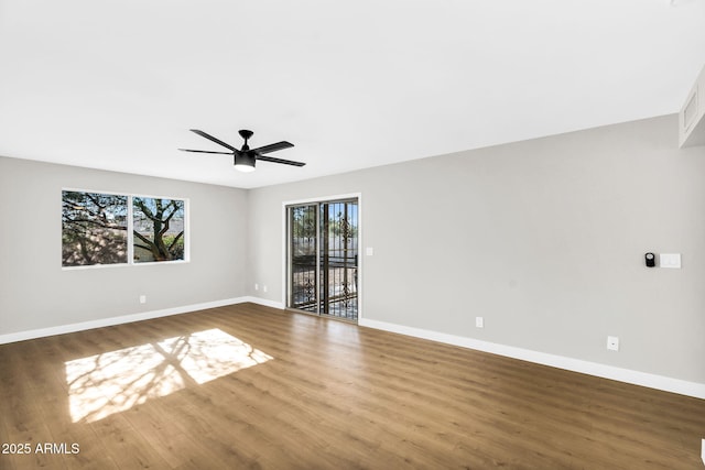 25810 S Boxwood Dr, Sun Lakes, AZ 85248 - unfurnished room featuring baseboards, wood finished floors, and ceiling fan