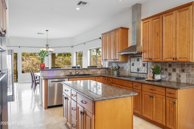 kitchen with visible vents, a sink, dishwasher, wall chimney exhaust hood, and black electric cooktop