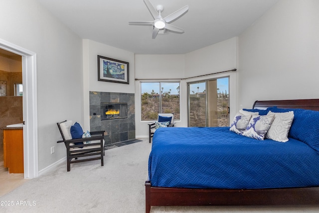 bedroom with a fireplace, carpet, baseboards, and a ceiling fan