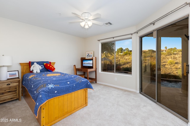 carpeted bedroom featuring visible vents, baseboards, ceiling fan, and access to outside