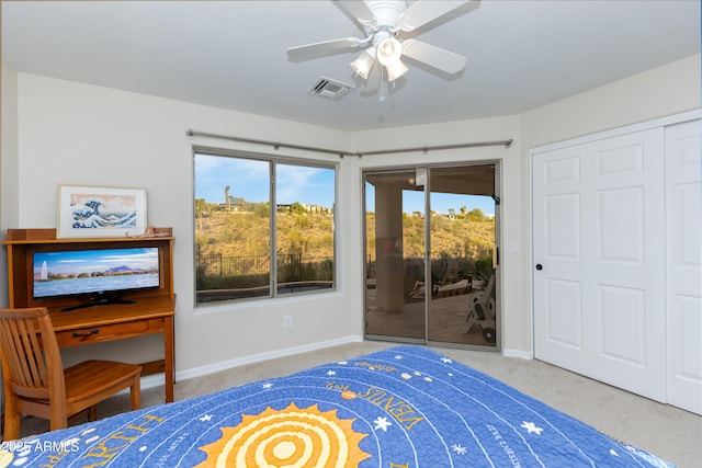 carpeted bedroom featuring a ceiling fan, access to outside, baseboards, and visible vents