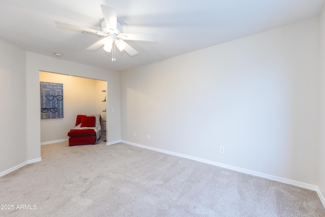 unfurnished room with baseboards, carpet, and ceiling fan