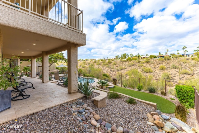 view of yard with a fenced backyard, a fenced in pool, and a patio