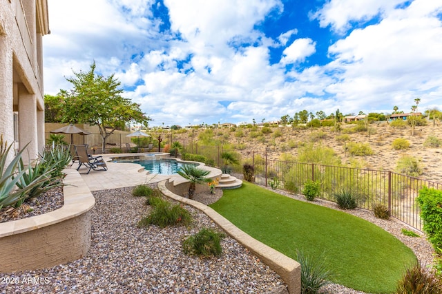 view of yard featuring a fenced backyard, a fenced in pool, and a patio