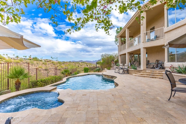 view of swimming pool with a patio area, a fenced in pool, an in ground hot tub, and a fenced backyard