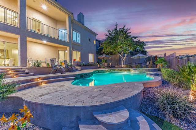 view of swimming pool featuring a fenced in pool, a fenced backyard, and a patio area