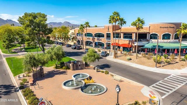 birds eye view of property with a mountain view