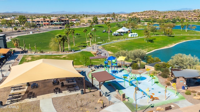 birds eye view of property with a water and mountain view