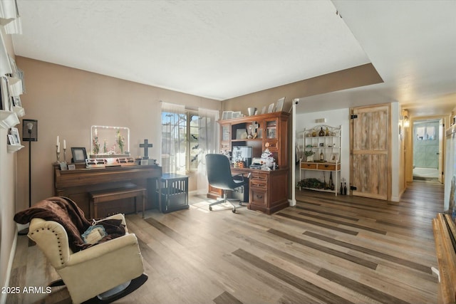 office with hardwood / wood-style flooring