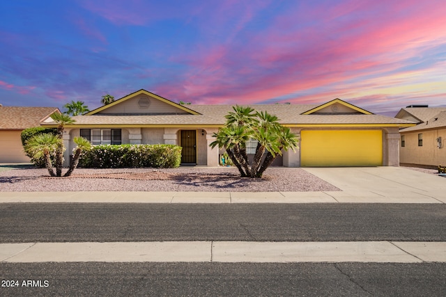 single story home with a garage