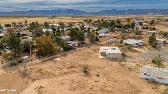 birds eye view of property with a mountain view