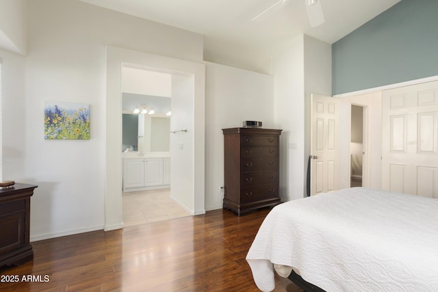 bedroom featuring wood-type flooring, ensuite bath, and ceiling fan