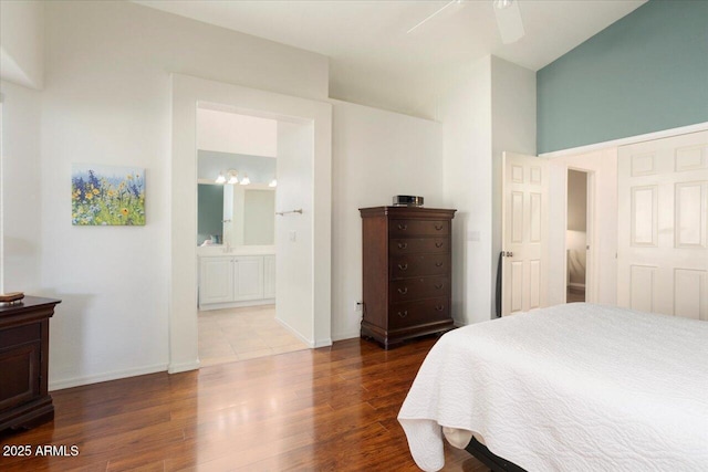 bedroom featuring connected bathroom, ceiling fan, and hardwood / wood-style floors