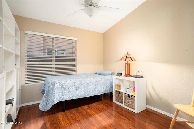 bedroom with hardwood / wood-style floors, ceiling fan, and lofted ceiling