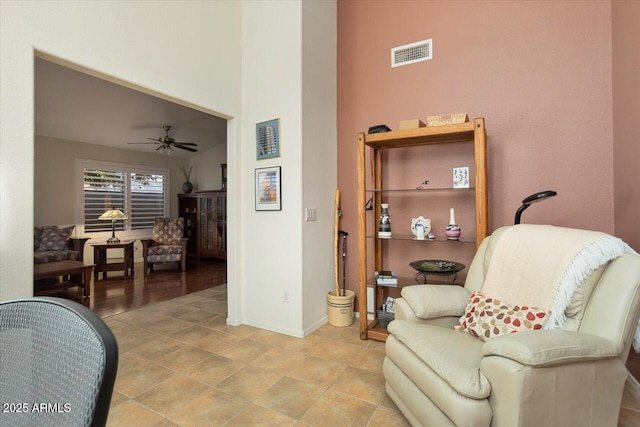 living area with ceiling fan