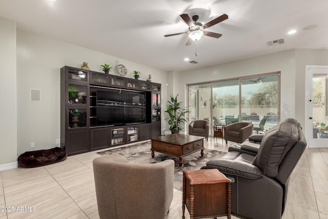 living room featuring baseboards, recessed lighting, visible vents, and a ceiling fan