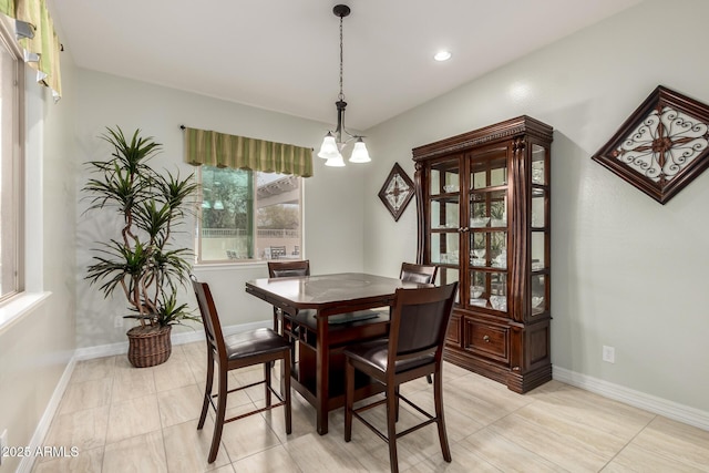 dining room featuring baseboards, a chandelier, and recessed lighting