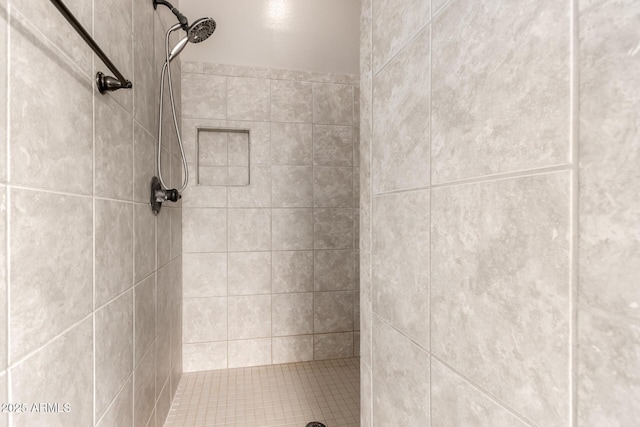 full bath featuring tiled shower