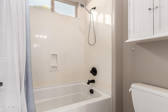 full bathroom featuring shower / bath combo and toilet