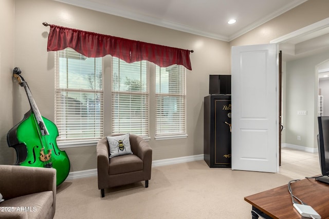 sitting room with light carpet, ornamental molding, recessed lighting, and baseboards