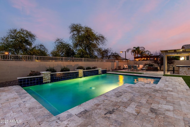 pool at dusk featuring a fenced backyard, a fenced in pool, and a patio