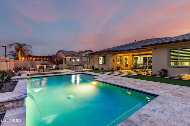 view of swimming pool with area for grilling, a patio area, a fenced backyard, and a fenced in pool