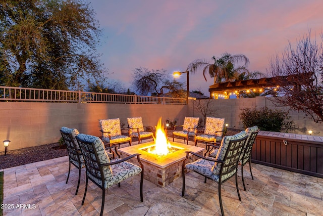 view of patio featuring a fire pit and a fenced backyard