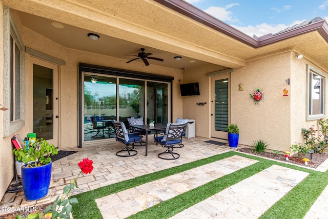 view of patio featuring ceiling fan