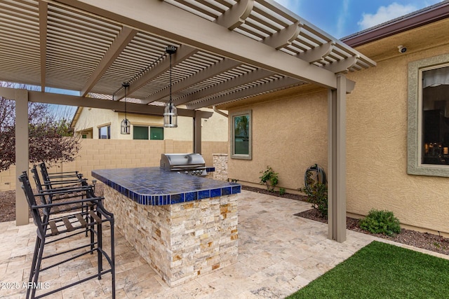 view of patio featuring area for grilling, fence, outdoor dry bar, grilling area, and a pergola
