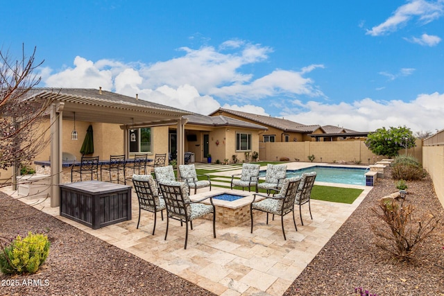 view of patio / terrace featuring a fenced backyard, a fire pit, a pergola, and a fenced in pool